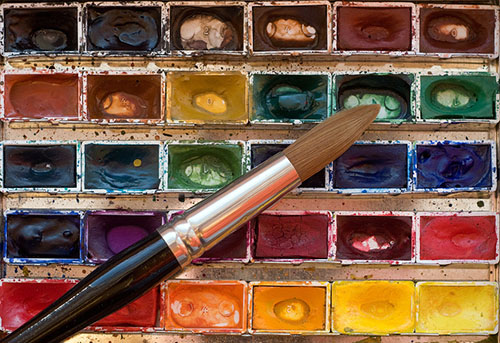 Malkasten mit Aquarellpinsel - Copyright Adobe Stock + Thomas #11406230